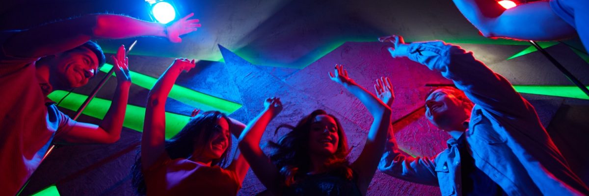 Young friendly dancers having fun at party